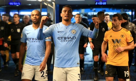 Danilo, centre, and Fernandinho of Manchester City celebrate after the Premier League win over Wolves.