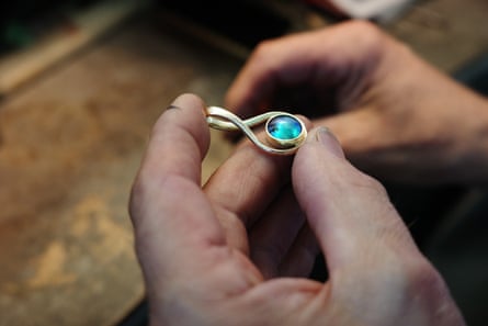 Jacek Pawlowski sets a pāua pearl in a pendant.