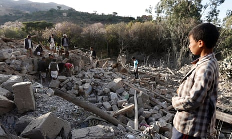 People search under the rubble of damaged houses following an airstrike on the outskirts of Yemen’s capital, Sana’a
