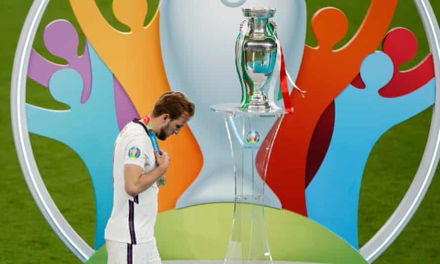 Harry Kane walks past the Henri Delaunay trophy after England’s shootout defeat by Italy in the Euro 2020 final