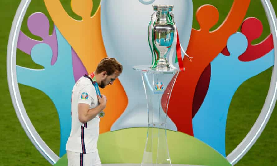 Harry Kane says Euro 2020 loss and Manchester City transfer saga took toll | Harry Kane 2 Harry Kane walks past the Henri Delaunay trophy after England’s shootout defeat by Italy in the Euro 2020 final