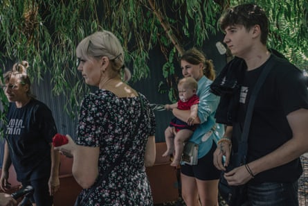 Family group with baby held in woman’s arms