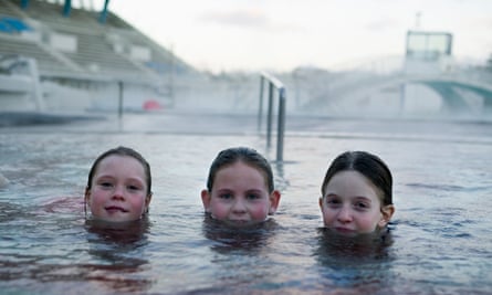 Three girls swimming in Laugardalslaug  pool