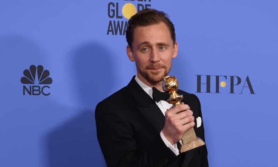 Tom Hiddleston poses with his award for best actor in a limited television series