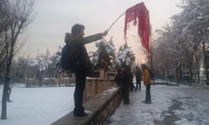A Twitter image of an unidentified woman protesting against compulsory hijab rules