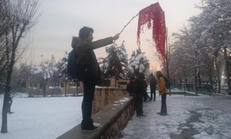 A Twitter image of an unidentified woman protesting against compulsory hijab rules