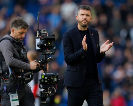 Michael Carrick applauds the fans