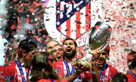Diego Costa lifts the trophy after his two goals helped Atlético Madrid to win the Super Cup.