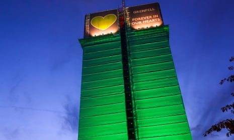 The remains of Grenfell Tower wrapped in green to commemorate victims of the fire