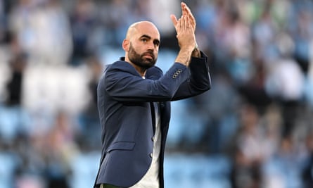 Manager Claudio Giráldez applauds supporters.