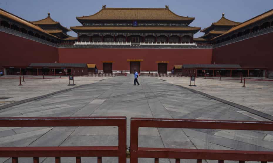 A worker near the closed entrance to the Forbidden City, Beijing, on 30 April.