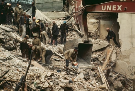 Rescue workers sift through rubble after the 1977 Bucharest earthquake.