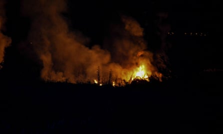 Flames rise at the crash site of an Antonov An-12 cargo plane owned by a Ukrainian company, near Kavala, Greece.