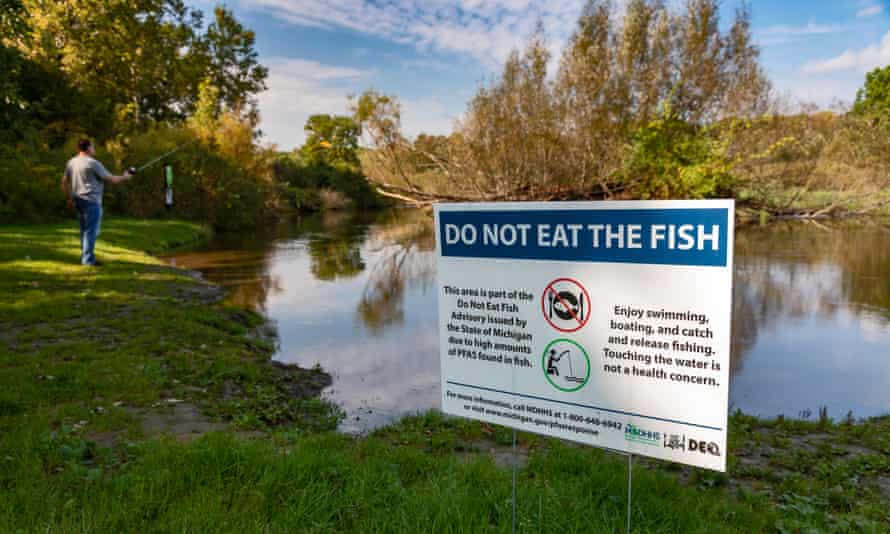 A sign at Island Lake state recreation area in Michigan warns anglers not to eat fish from the Huron River