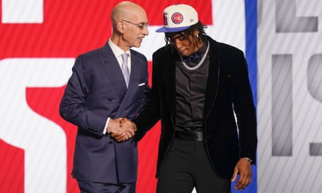 Adam Silver has a word with Jaden Ivey as he heads to Detroit
