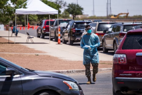 A long line of cars make their way as US Army personnel lead a Covid-19 drive-thru testing site in El Paso, Texas, USA on 10 July, 2020. El Paso has reported sharp rises in the number of coronavirus cases.