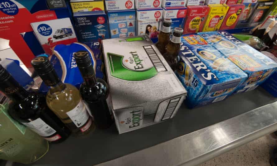 wine and beer on a supermarket checkout conveyor belt