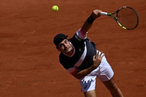 Italy's Giulio Zeppieri serves to Norway's Casper Ruud.