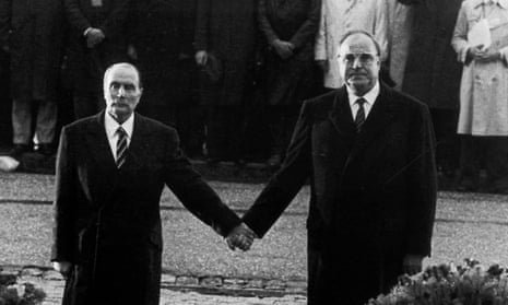 Then French president François Mitterrand and then German chancellor Helmut Kohl hold hands during a visit to Verdun in 1984.