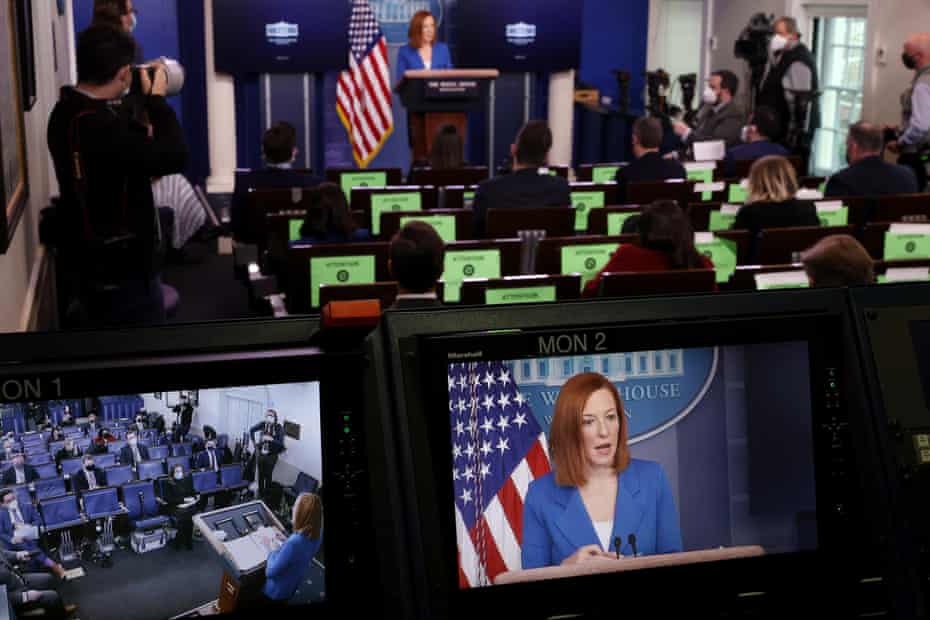 Jen Psaki is seen on a monitor during the daily briefing at the White House on 2 February.