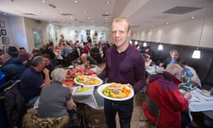 Everton and Scotland star Steven Naismith hands out the Christmas dinner at the Loaves and Fishes charity Christmas Lunch for the homeless.