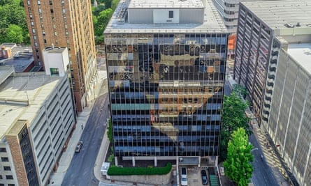 Aerial view of square shiny building taking up a full city block.
