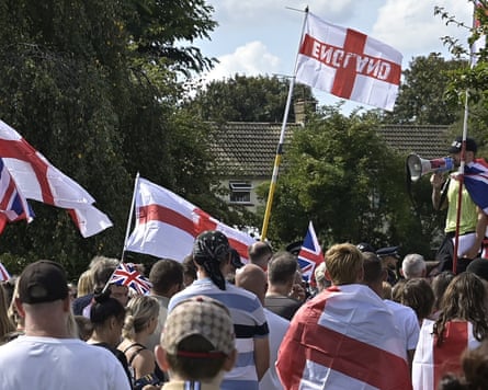 Anti-migrant protesters march in Faversham, Kent, 6 September 2025.