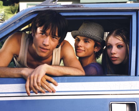 Teenagers leaning out of a car window