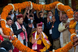 The Dalai Lama is presented with a giant garland by the organisers of an event commemorating the 25th anniversary of the Bharat Tibet Sahyog Manch at the Tsuglakhang temple in Dharamshala, India, Friday, May 5, 2023.
