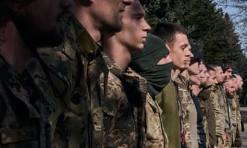 Young recruits undergo military training in Kyiv.
