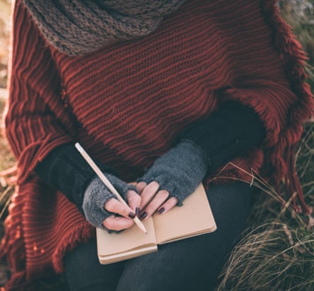 Woman writes in a journal