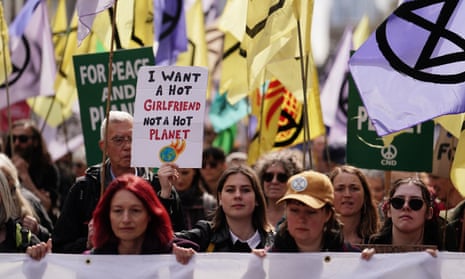 Activists march at the Big One protest in London, 24 April 2023.