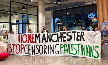 Artists with banner saying 'Home Manchester Stop Censoring Palestinians'