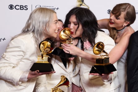 From left: Phoebe Bridgers, Julien Baker and Lucy Dacus of Boygenius, and Taylor Swift pictured at the 2024 Grammy awards.