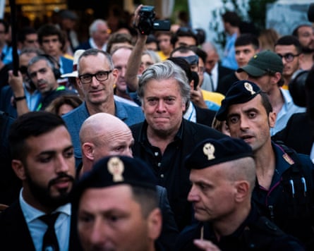 Steve Bannon makes his way through a crowd