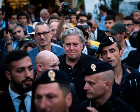 Steve Bannon makes his way through a crowd