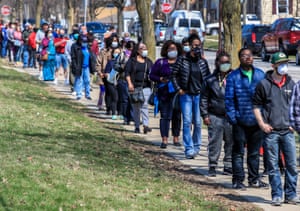 Voters wait in line to cast their ballots in the Wisconsin presidential primary election.