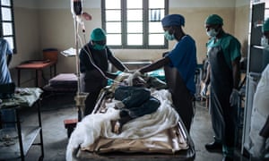 Medics at Oicha hospital in eastern DRC treat a man’s head injuries after an attack by unknown assailants in his village.