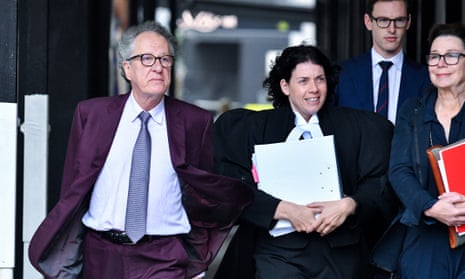 Australian actor Geoffrey Rush and his legal team arrive at the federal court in Sydney on Wednesday