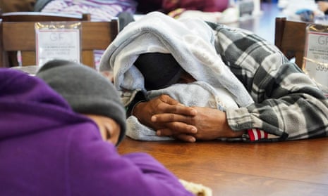 People take shelter at a furniture store that transformed into a warming station during the blackouts in Houston, Texas, on 17 February. 