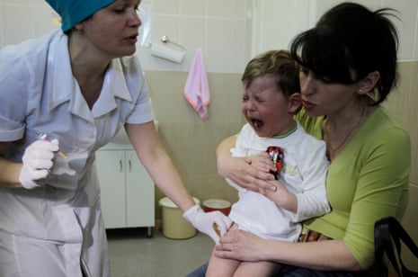 A child is vaccinated against diphtheria, whooping cough and tetanus in a children’s hospital in Kiev, Ukraine