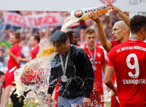 Bayern Munich’s Arjen Robben pours beer on Bayern Munich coach Niko Kovac as they celebrate winning the Bundesliga.
