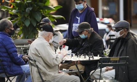 People wearing face masks play chess at Bryant Park in New York, the United States, November 6, 2020.