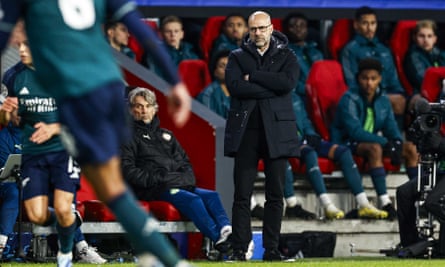 Peter Bosz stands on the touchline.