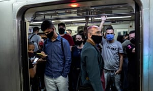 Passengers wearing face masks at the Se metro station in downtown São Paulo, Brazil
