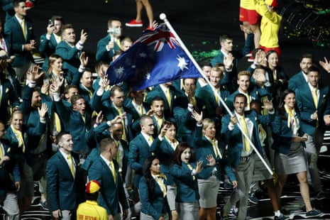 Team Australia, lead by flag bearer Mark Knowles.