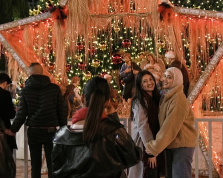 People taking photos last week among Christmas decorations in Bethlehem’