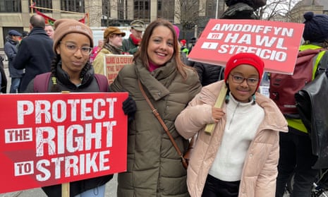 Shavanah Taj, the general secretary of Wales TUC, with her daughters at a TUC rally in Cardiff, 1 February.