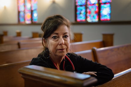 Woman sitting for a portrait on a church pew