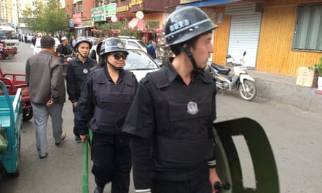 Police on patrol in Urumqi, the capital of Xinjiang.